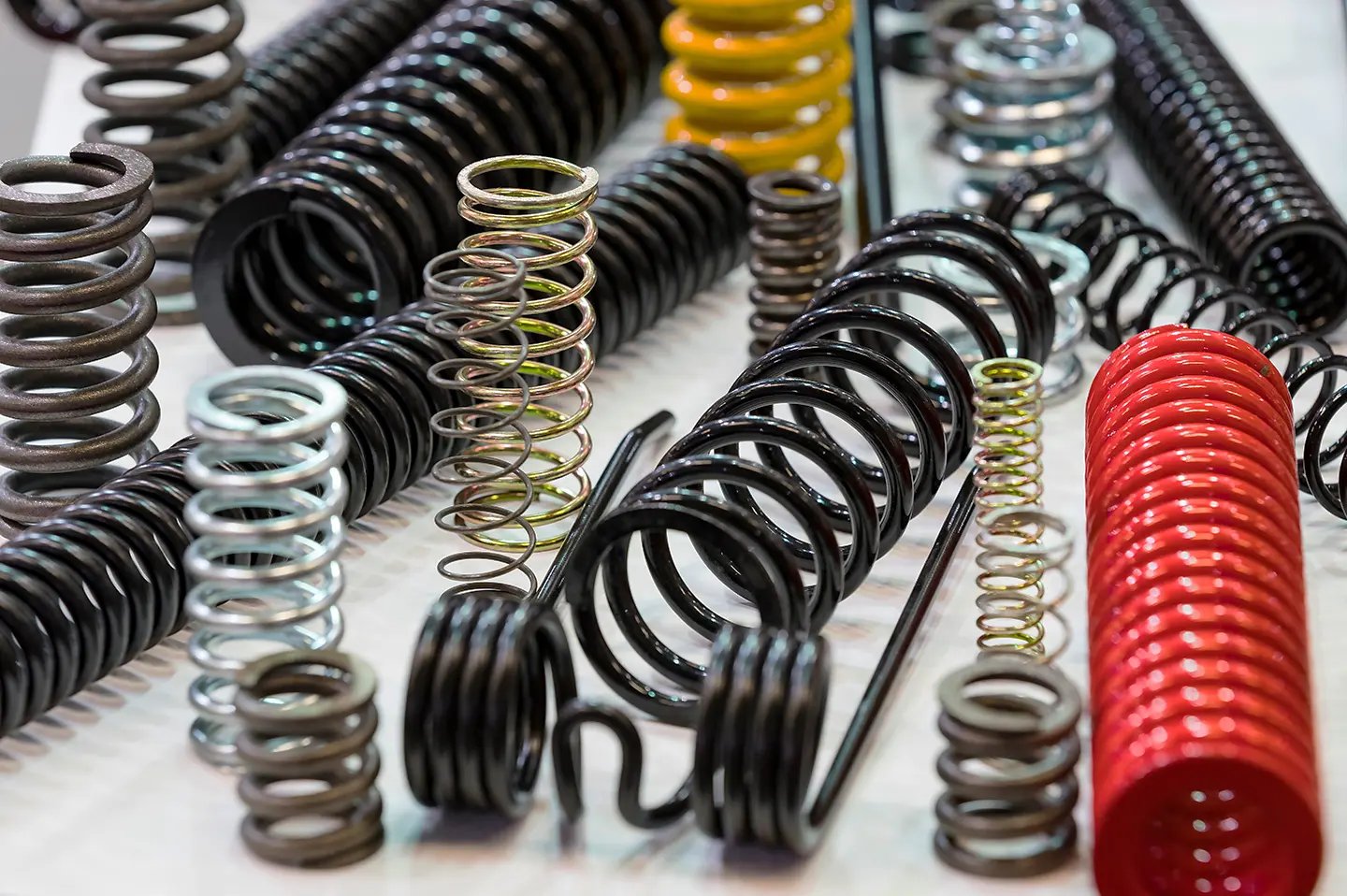 Tough, durable springs and wireforms for construction